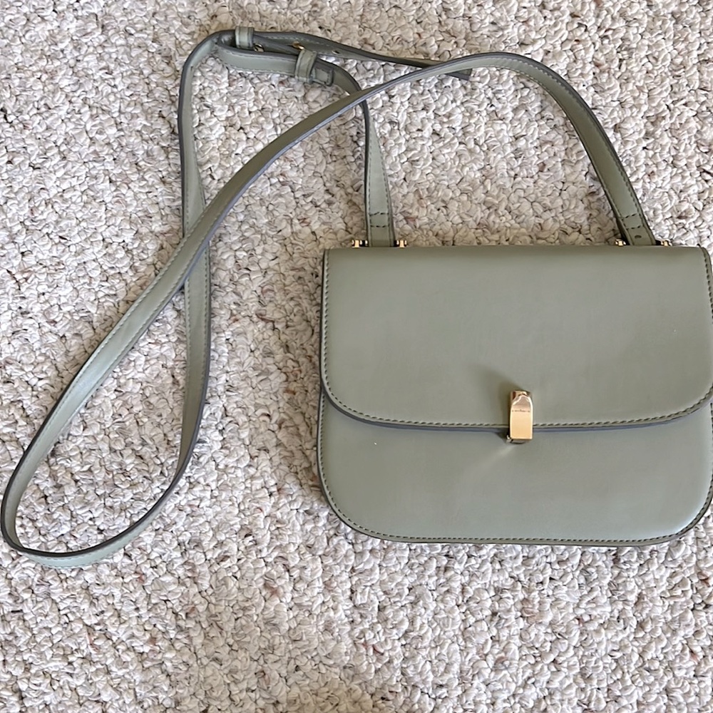 Sage green small purse. Five individual pockets on inside. Very lightly used.